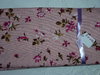 Coupon de tissus patch fleur coloré sur fond rose 150*50cm